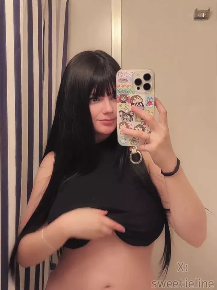 Dorm Room Tease – Beautiful Brunette Lifts Black Top to Show Big Natural Tits